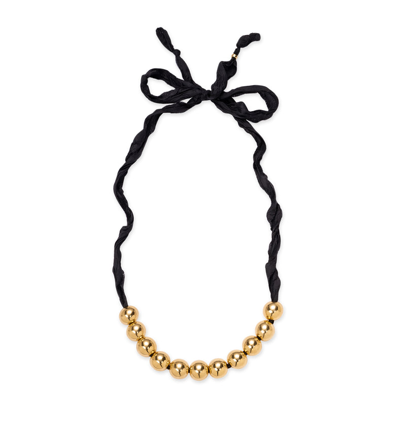  Perles de résine dorées sur un ruban noir 2 
